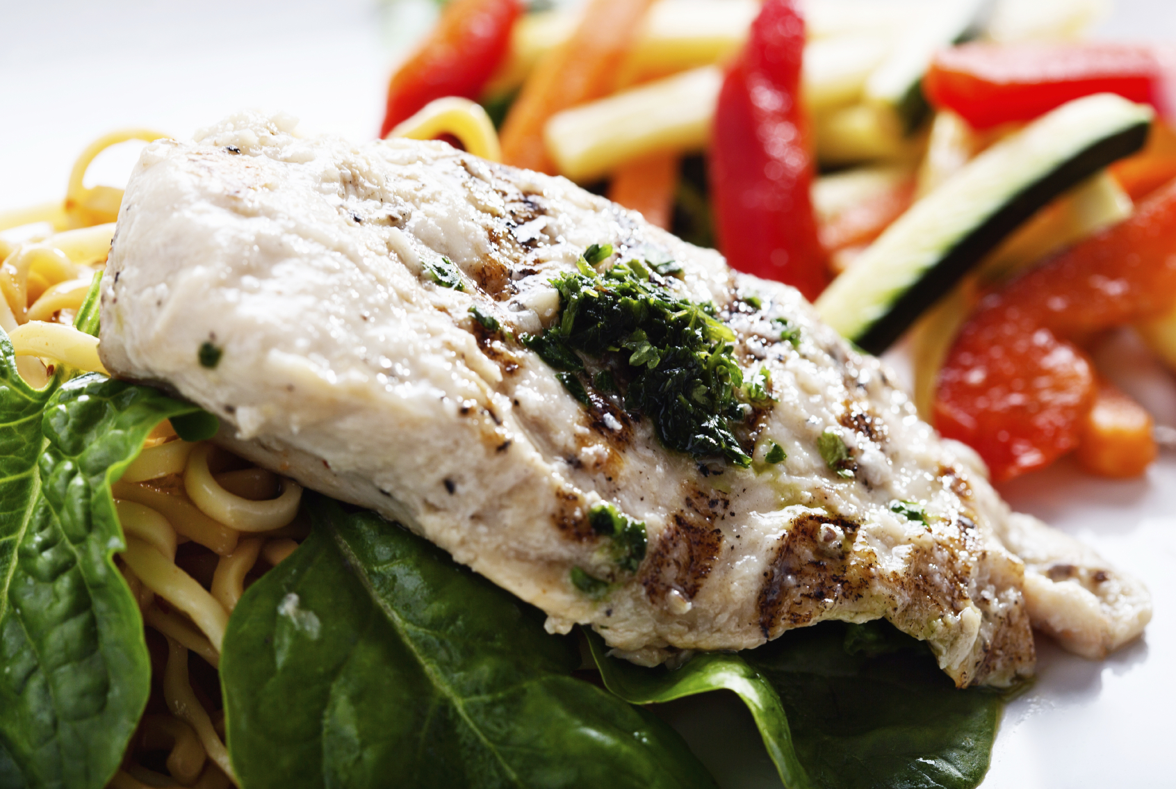 Succulent steamed seared chicken breast with pesto and vegetables