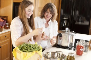 Canning: Caucasian Mother Teenage Daughter Preserving Homegrown